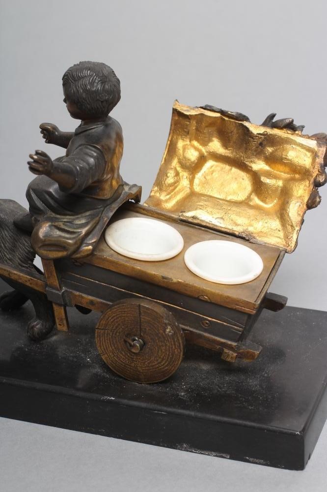 A BRONZED AND PARCEL GILT INKWELL Image