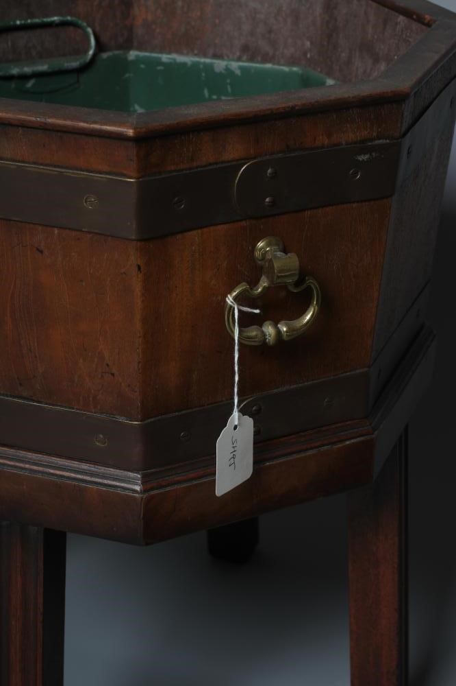 A MAHOGANY AND BRASS BOUND JARDINIERE Image