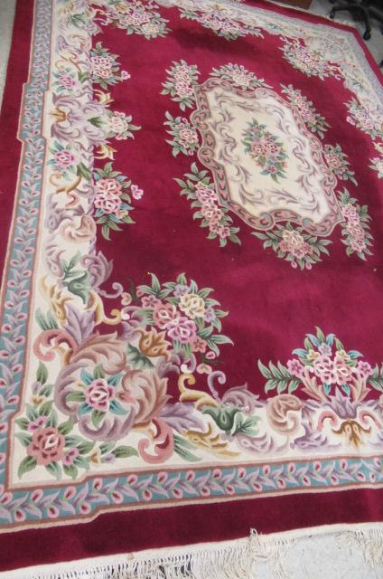 A CHINESE WASHED AND FRINGED CARPET Image