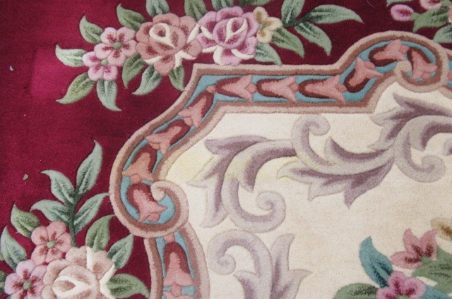 A CHINESE WASHED AND FRINGED CARPET Image