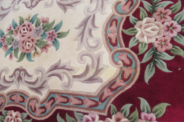 A CHINESE WASHED AND FRINGED CARPET Image