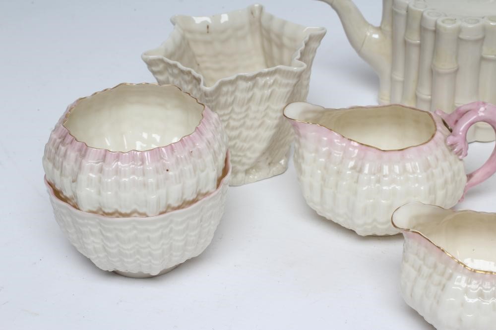 A VICTORIAN FIRST PERIOD BELLEEK PORCELAIN NAUTILUS TEA SERVICE with shaded pink rims Image