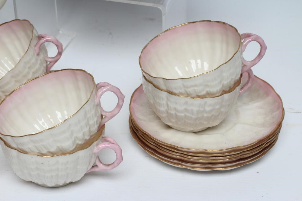 A VICTORIAN FIRST PERIOD BELLEEK PORCELAIN NAUTILUS TEA SERVICE with shaded pink rims Image
