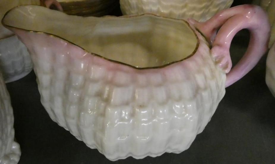 A VICTORIAN FIRST PERIOD BELLEEK PORCELAIN NAUTILUS TEA SERVICE with shaded pink rims Image