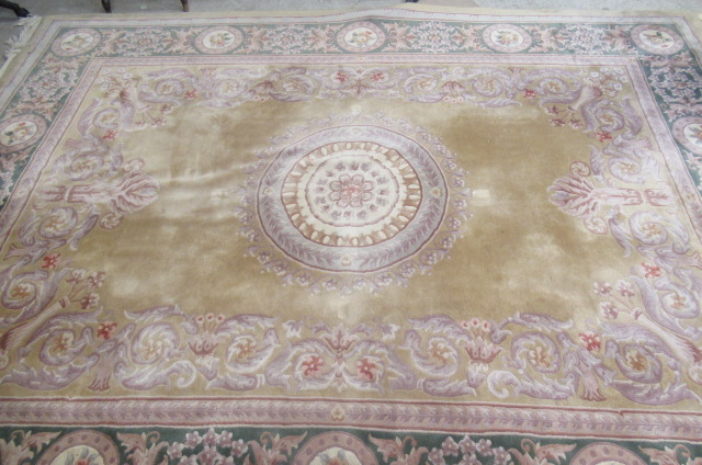 A CHINESE WASHED AND FRINGED CARPET Image