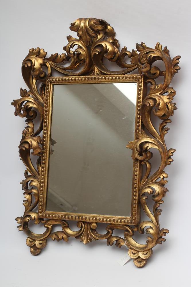 A CARVED GILT WOOD WALL MIRROR Image