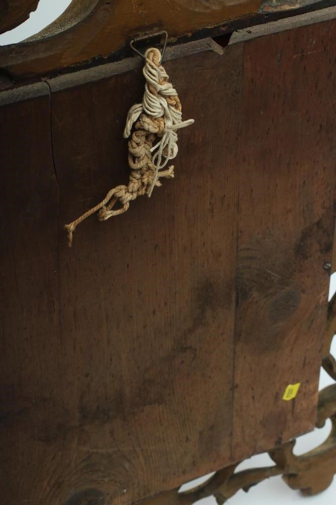 A CARVED GILT WOOD WALL MIRROR Image