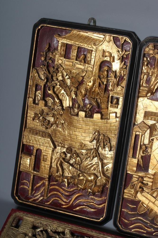 A PAIR OF CHINESE RELIEF CARVED WOOD PANELS Image