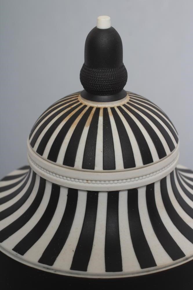 A WEDGWOOD BLACK JASPER DIP "DANCING HOURS" URN AND COVER Image