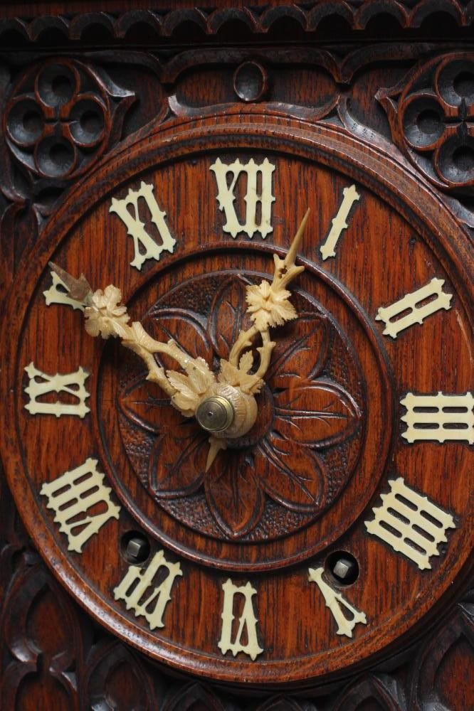 AN OAK CASED CUCKOO TABLE CLOCK Image