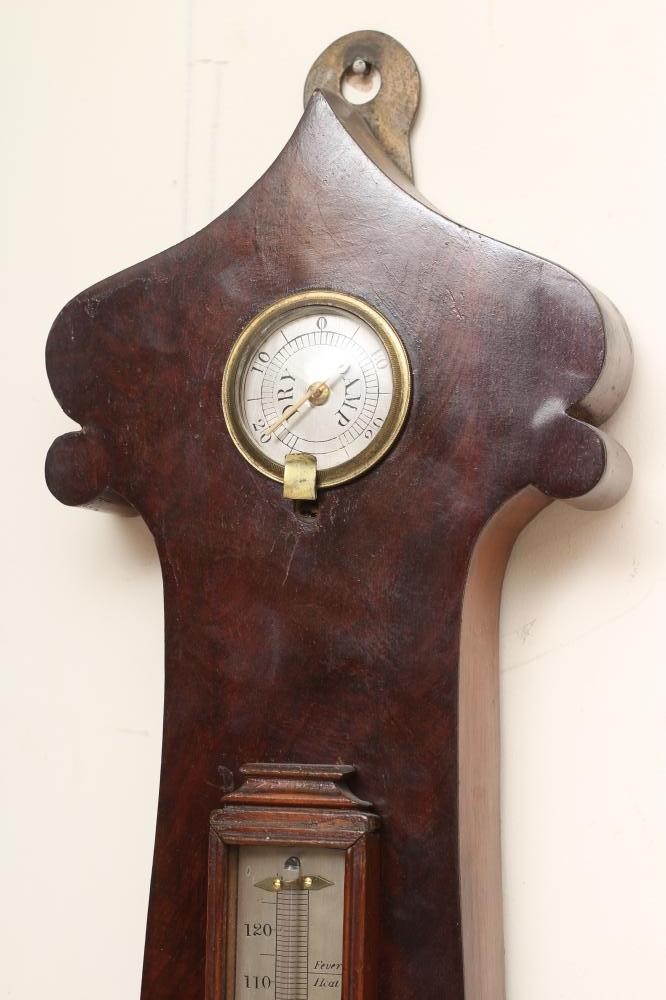 A LARGE MAHOGANY WHEEL BAROMETER Image