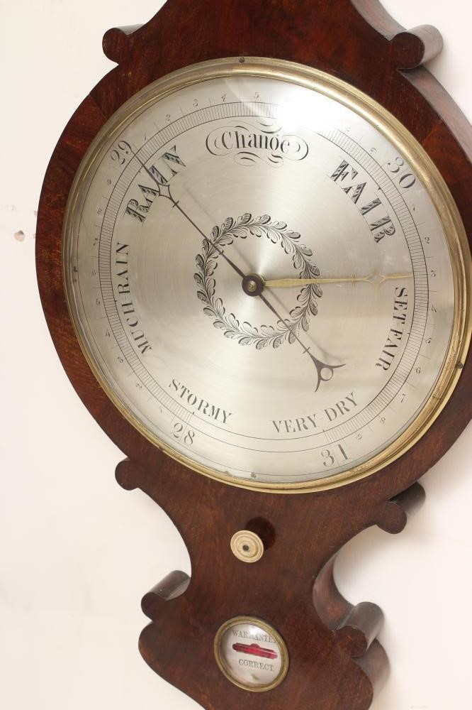 A LARGE MAHOGANY WHEEL BAROMETER Image