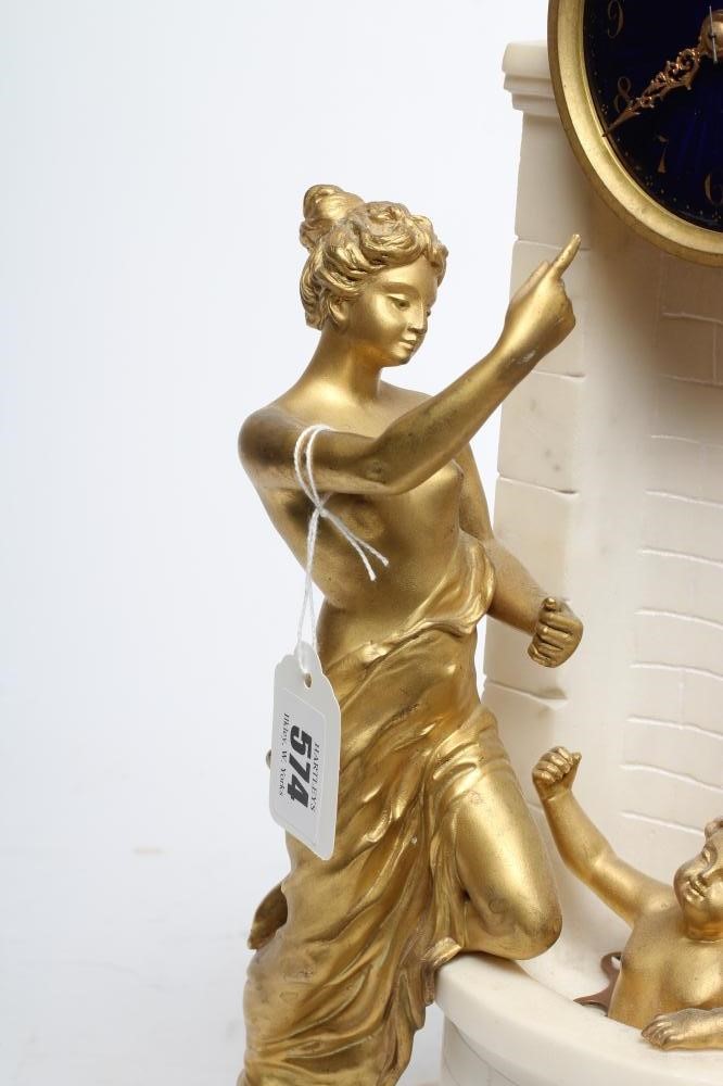 A GILT METAL AND WHITE MARBLE CASED MANTEL CLOCK Image