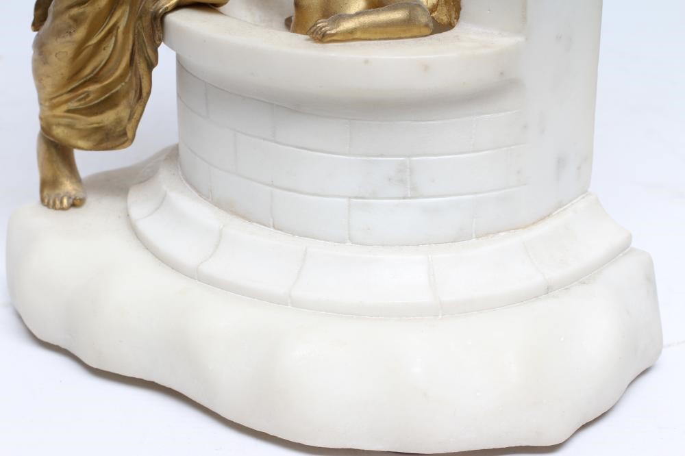 A GILT METAL AND WHITE MARBLE CASED MANTEL CLOCK Image