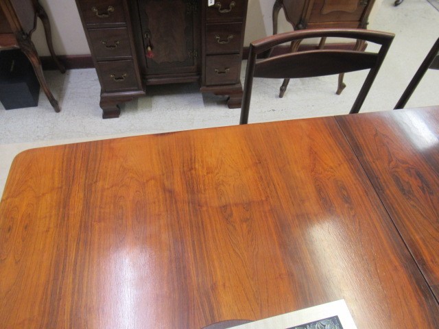 A McINTOSH DINING SUITE designed by Tom Robertson Image