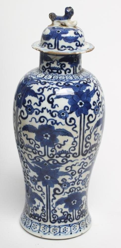 A PAIR OF CHINESE PORCELAIN GU VASES painted in underglaze blue with prunus on a dark shaded ground Image