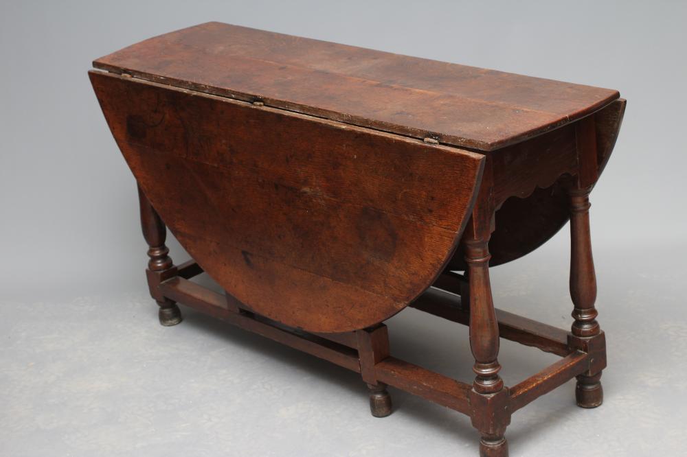 AN OAK DROP LEAF TABLE  Image