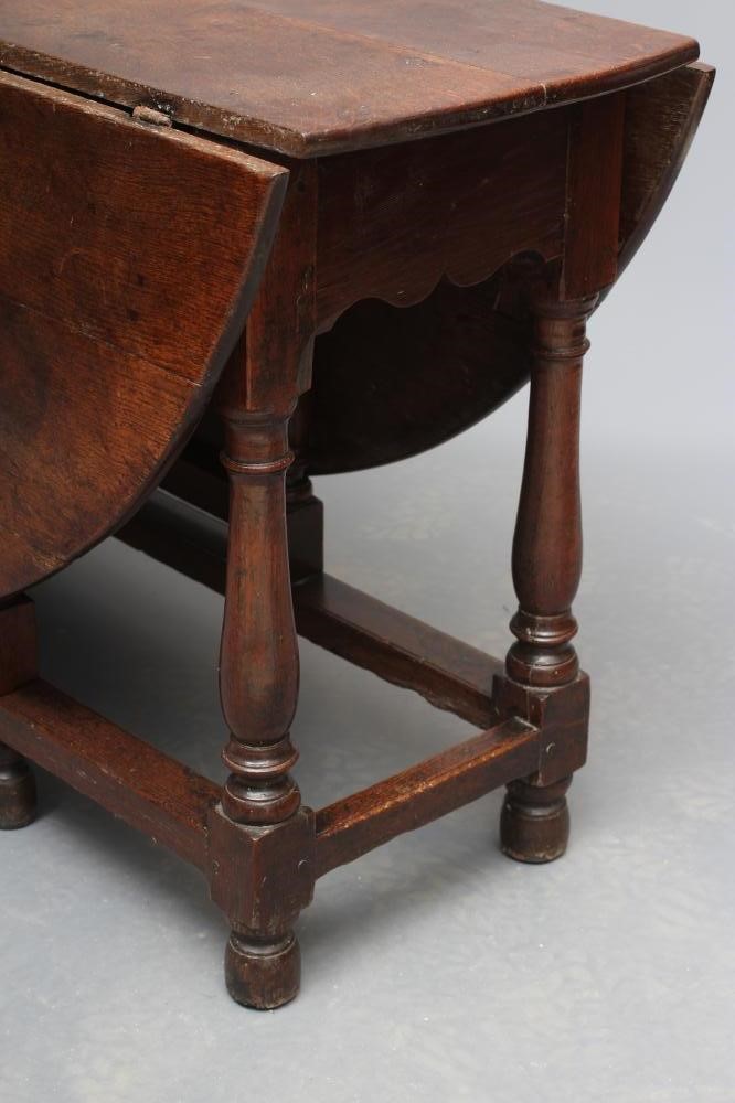 AN OAK DROP LEAF TABLE  Image