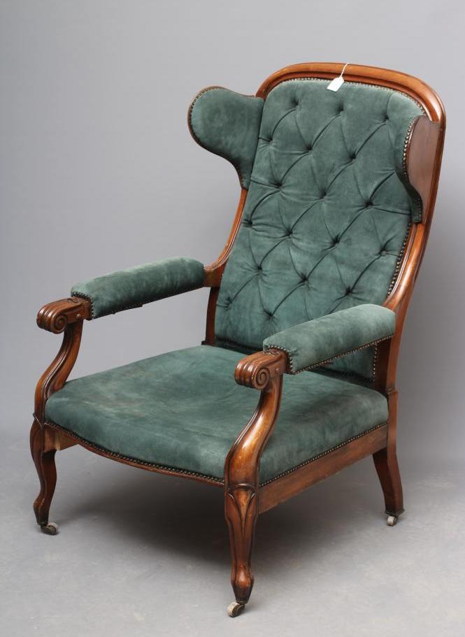 A WILLIAM IV MAHOGANY RECLINING LIBRARY WING ARMCHAIR with pull out leg rest Image