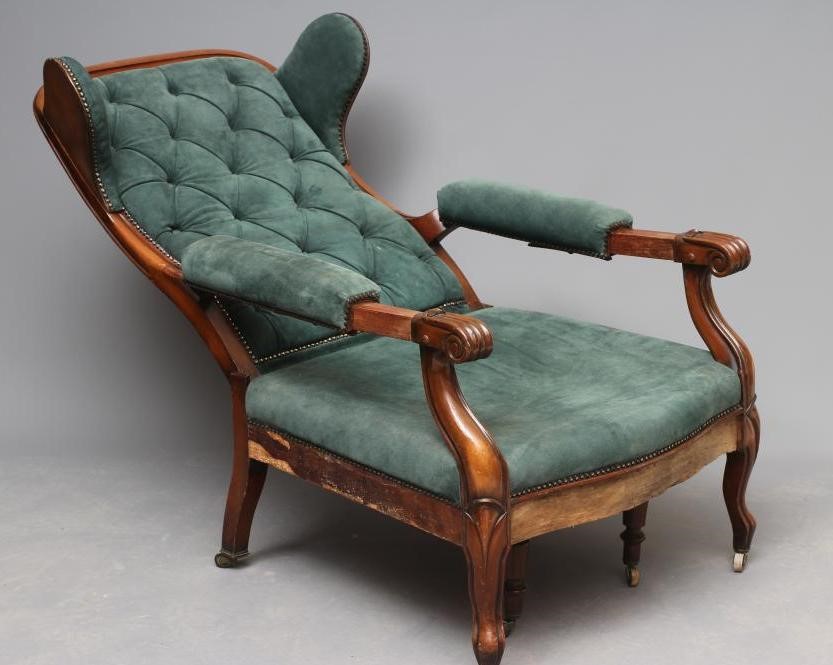 A WILLIAM IV MAHOGANY RECLINING LIBRARY WING ARMCHAIR with pull out leg rest Image
