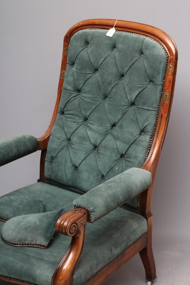 A WILLIAM IV MAHOGANY RECLINING LIBRARY WING ARMCHAIR with pull out leg rest Image