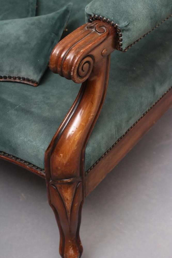 A WILLIAM IV MAHOGANY RECLINING LIBRARY WING ARMCHAIR with pull out leg rest Image