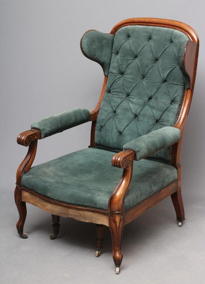 A WILLIAM IV MAHOGANY RECLINING LIBRARY WING ARMCHAIR with pull out leg rest Image