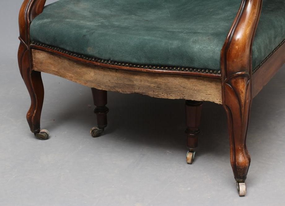 A WILLIAM IV MAHOGANY RECLINING LIBRARY WING ARMCHAIR with pull out leg rest Image