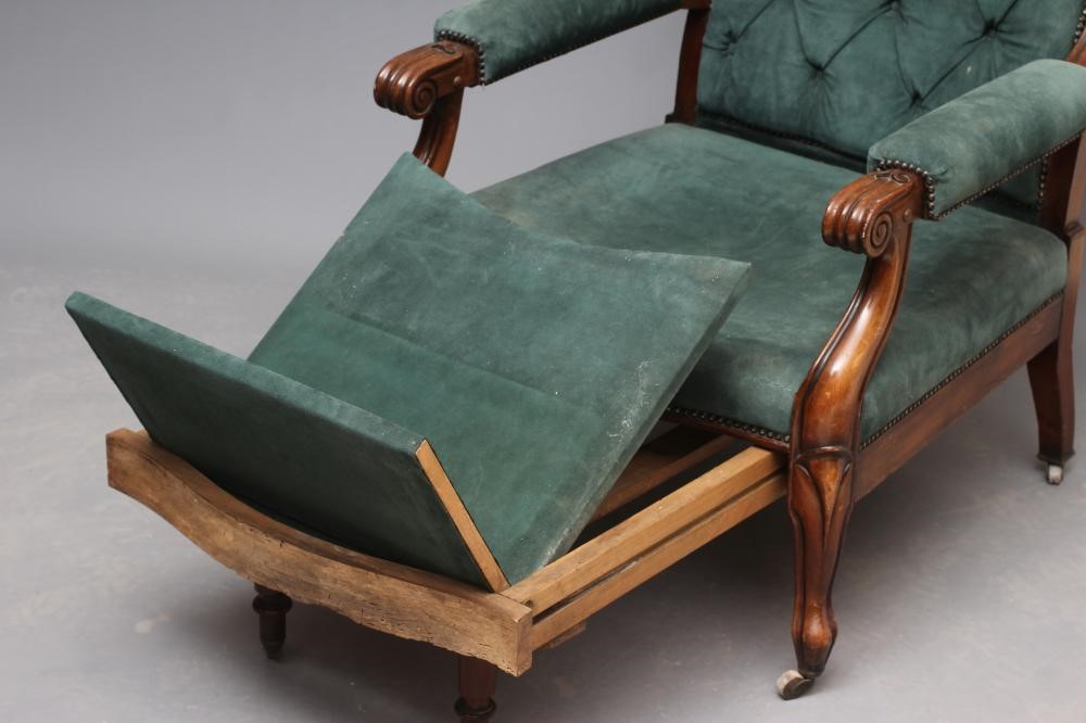 A WILLIAM IV MAHOGANY RECLINING LIBRARY WING ARMCHAIR with pull out leg rest Image