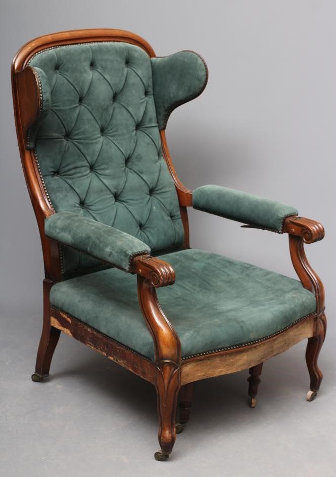 A WILLIAM IV MAHOGANY RECLINING LIBRARY WING ARMCHAIR with pull out leg rest Image