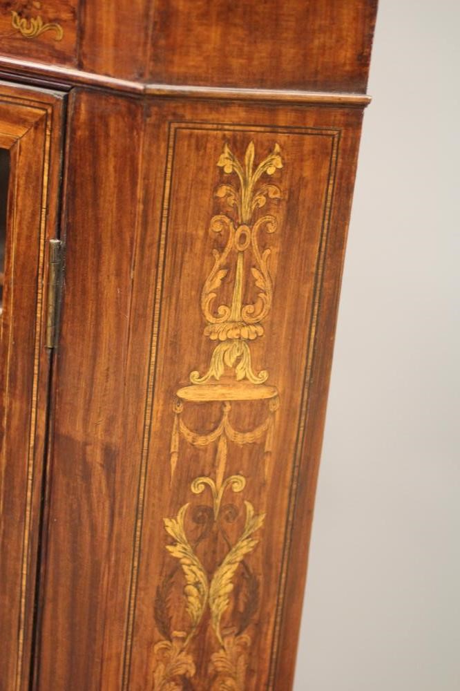 A MAHOGANY CORNER CUPBOARD Image