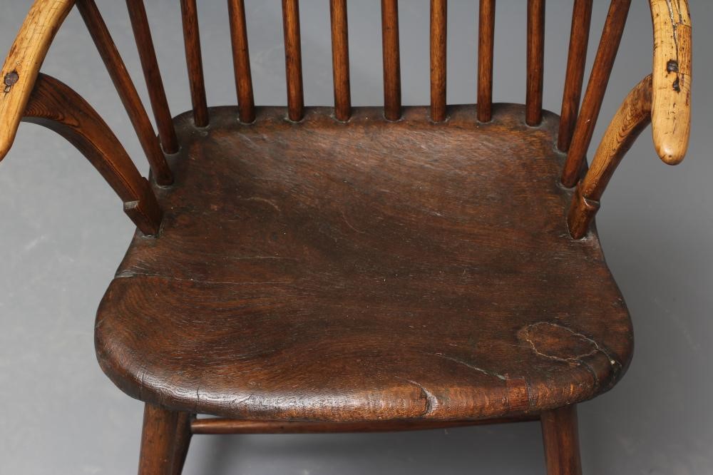 AN ASH COMB BACK WINDSOR ARMCHAIR Image