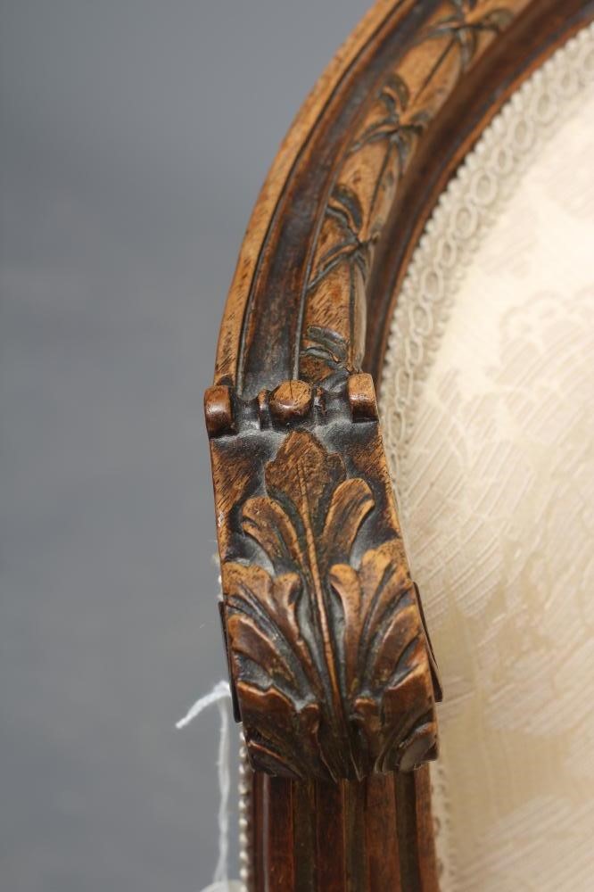 A MAHOGANY AND PARCEL GILT TUB CHAIR in Louis XV style Image