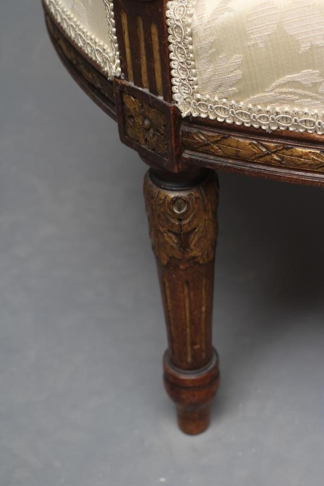 A MAHOGANY AND PARCEL GILT TUB CHAIR in Louis XV style Image