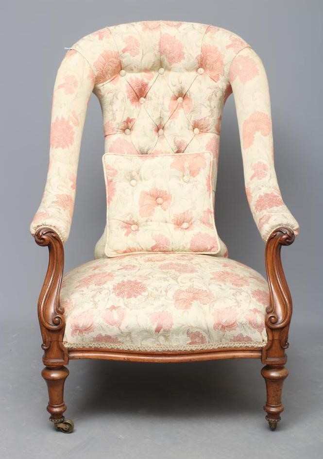 A VICTORIAN WALNUT SALON CHAIR button upholstered in a pale cream and salmon weave Image