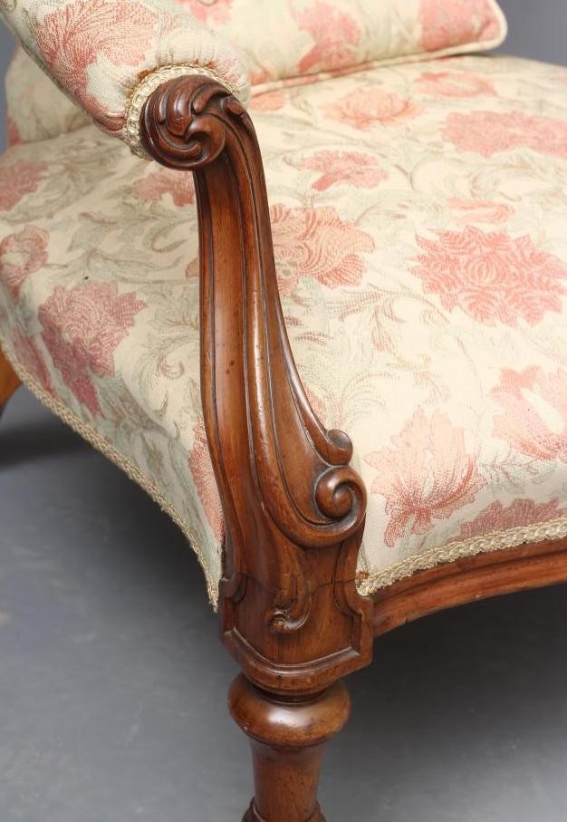 A VICTORIAN WALNUT SALON CHAIR button upholstered in a pale cream and salmon weave Image