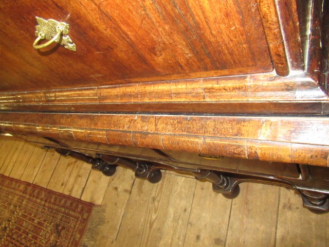 A GEORGIAN WALNUT AND BANDED CHEST ON STAND Image