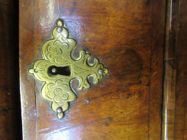 A GEORGIAN WALNUT AND BANDED CHEST ON STAND Image