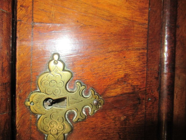 A GEORGIAN WALNUT AND BANDED CHEST ON STAND Image