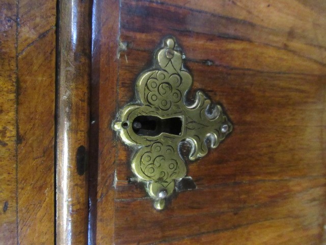 A GEORGIAN WALNUT AND BANDED CHEST ON STAND Image