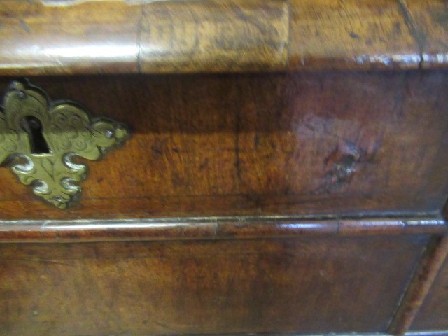 A GEORGIAN WALNUT AND BANDED CHEST ON STAND Image