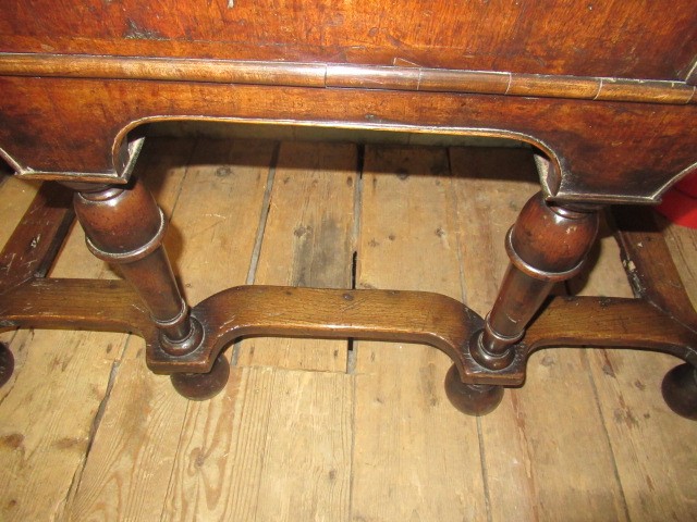 A GEORGIAN WALNUT AND BANDED CHEST ON STAND Image