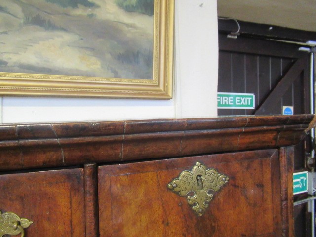 A GEORGIAN WALNUT AND BANDED CHEST ON STAND Image