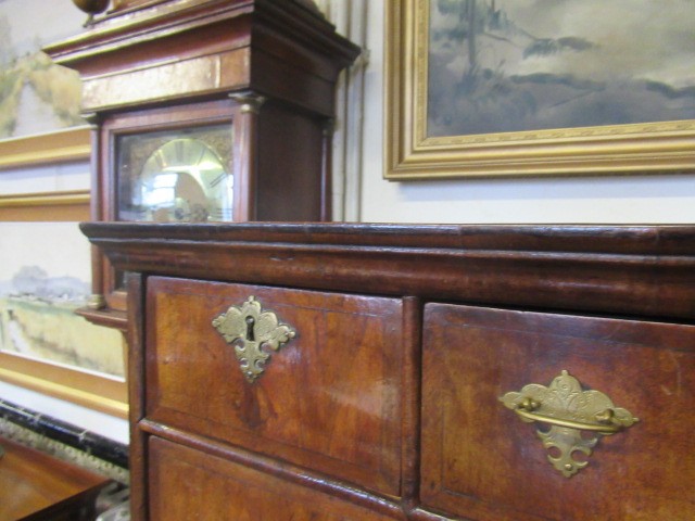 A GEORGIAN WALNUT AND BANDED CHEST ON STAND Image