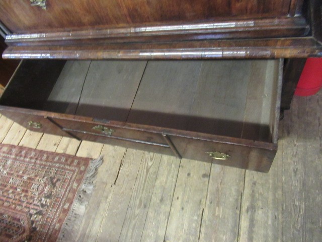 A GEORGIAN WALNUT AND BANDED CHEST ON STAND Image
