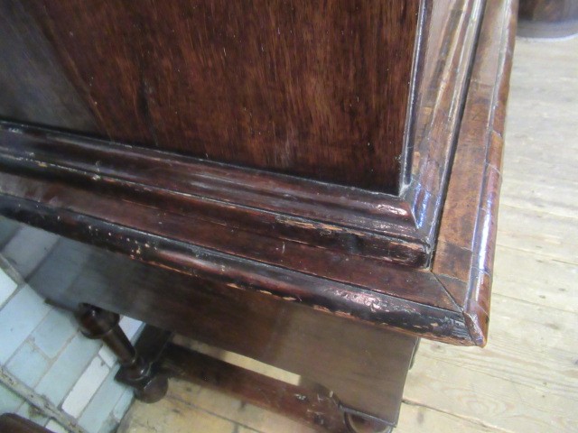 A GEORGIAN WALNUT AND BANDED CHEST ON STAND Image
