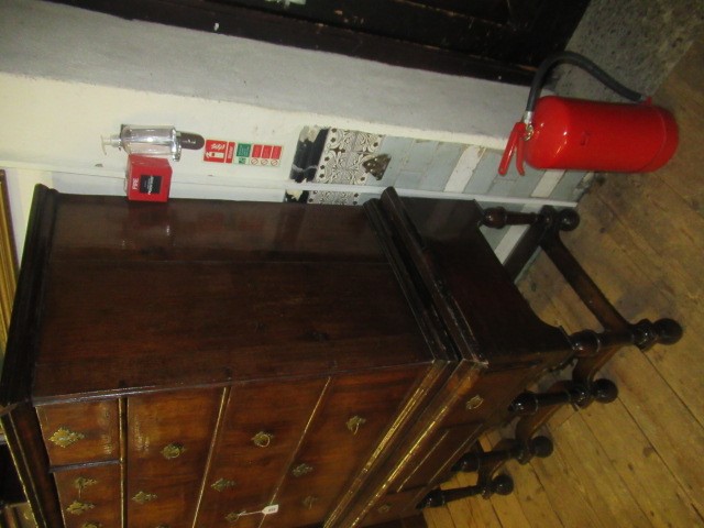 A GEORGIAN WALNUT AND BANDED CHEST ON STAND Image