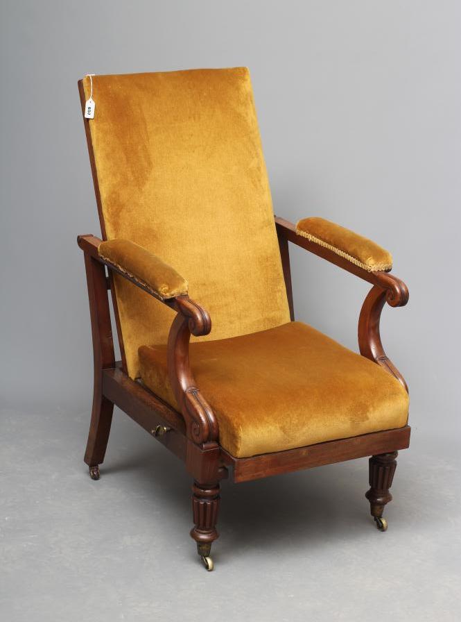 AN EARLY VICTORIAN MAHOGANY LIBRARY CHAIR upholstered in mustard dralon Image