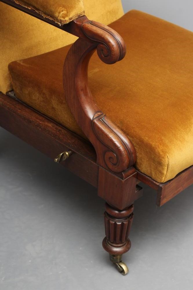 AN EARLY VICTORIAN MAHOGANY LIBRARY CHAIR upholstered in mustard dralon Image