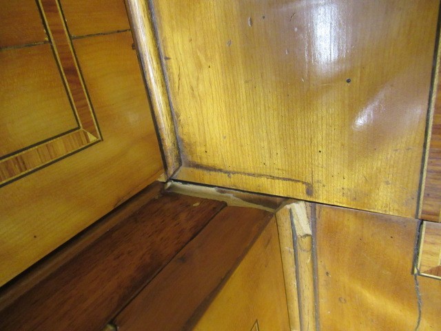 A MID VICTORIAN SATINWOOD BOOKCASE of breakfront form crossbanded with stringing Image
